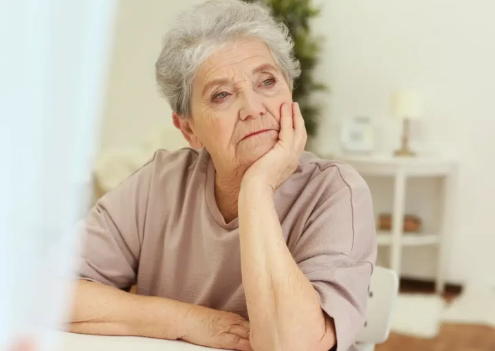Woman looking sadly into distance