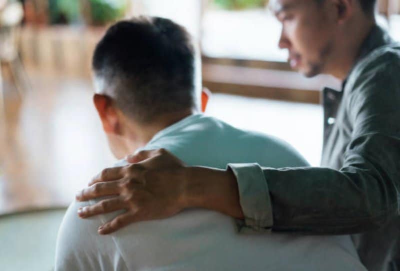 drug and alcohol misuse image with man being comforted