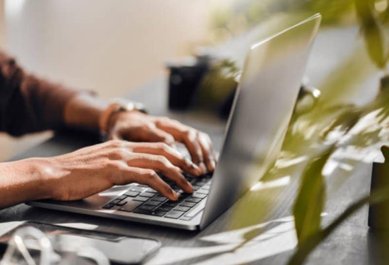 person using his computer