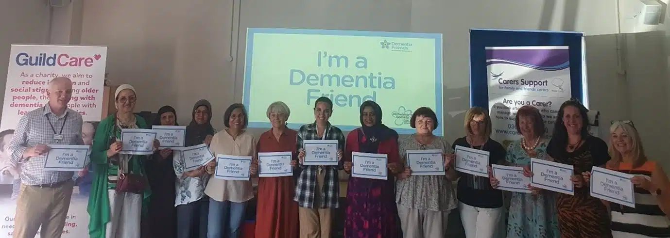 Group of people holding their Dementia Friend Certificates