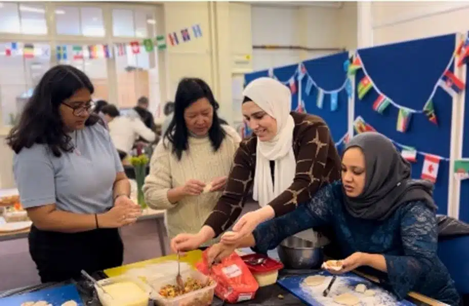 Group of women preparing dumplings