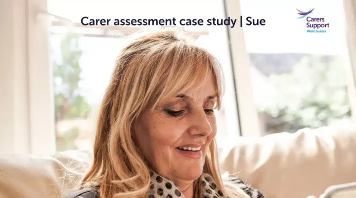 Woman looking down at phone smiling