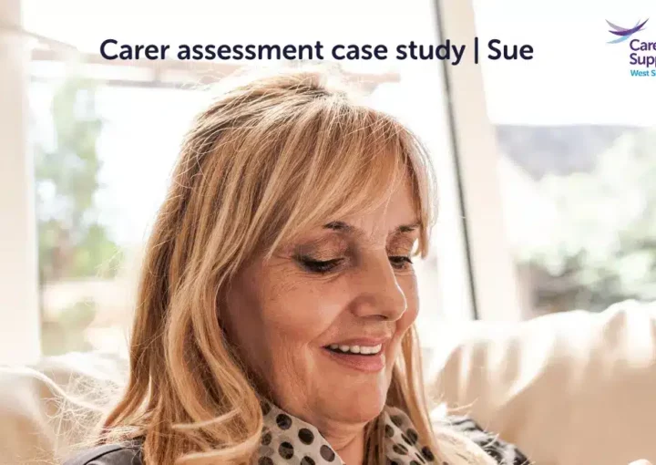 Woman looking down at phone smiling